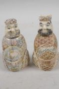A pair of Chinese bone snuff bottles in the form of two dignitaries, with inked engraved decoration,