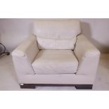 A Natuzzi leather easy chair