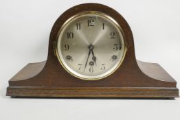 An oak cased Westminster Chime mantel clock with silvered dial and black Arabic numerals, 6¾" long
