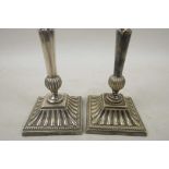 A pair of Mappin & Webb Princess Plate taper holders on ribbed square bases, 4½" high
