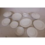 A Royal Doulton white glazed whorl pattern dinner service, one 12" x 10" platter, two tureens and