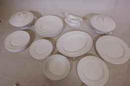 A Royal Doulton white glazed whorl pattern dinner service, one 12" x 10" platter, two tureens and
