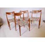 A set of four Norwegian mid century teak 'Bambi' 'Model 65' dining chairs by Rolf Rastad and Adolf