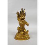 A Sino-Tibetan gilt bronze of a wrathful spirit, double vajra mark to base, 8½" high