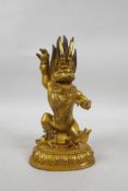 A Sino-Tibetan gilt bronze of a wrathful spirit, double vajra mark to base, 8½" high