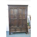 A large late C19th panelled oak housekeeper's cupboard, with two six panel doors over three panel