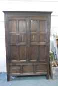 A large late C19th panelled oak housekeeper's cupboard, with two six panel doors over three panel