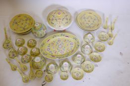 A Chinese famille jaune part dinner service to include oval platter, soup tureen, ginger jar,
