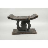 An African carved hardwood stool, 12" x 5½" x 15½" high