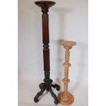A C19th mahogany torchere with spiral carved and reeded column on four carved legs, 57" high,