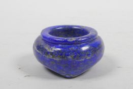 A Chinese carved lapis lazuli brush wash on tripod feet, 2½" diameter