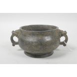 A Chinese two handled bronze censer, impressed seal mark to base, 4" diameter
