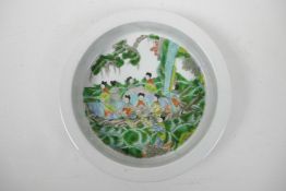 A Chinese famille verte porcelain dish decorated with women on a raft, 4 character mark to base, 8½"