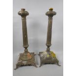 A pair of tall column candlesticks on square bases with elephant head feet, 18" high