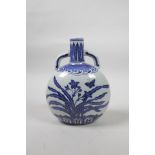 A Chinese blue and white porcelain two handled moon flask decorated with butterflies and flowers,