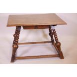 A stately mid C19th German centre table in oak, on turned and splayed legs, with flat and wide