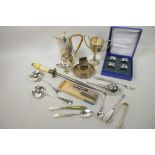 A quantity of silver plated items including Arts and Crafts hot water jug, ladles, napkin rings, nut