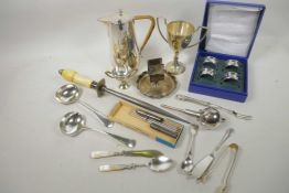 A quantity of silver plated items including Arts and Crafts hot water jug, ladles, napkin rings, nut