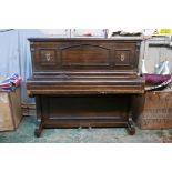 A John Brinsmead and Sons upright piano, with a rosewood case and iron frame, 56" x 26" x 51"