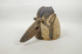 An early C20th African carved and painted wood bird mask, 7" high