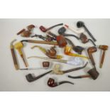 A box of various pipes including briar, opium, Black Forest etc