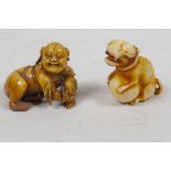 A small Japanese bone netsuke figure crouching with a flask, together with an Oriental figure of a