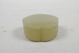 A Chinese celadon jade petal shaped pot and cover, 2" diameter