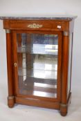 A C19th French Empire style mahogany display cabinet, with a marble top, mirrored back and