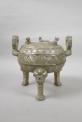 A Chinese mixed metal two handled censer and cover on tripod feet, with archaic style decoration,