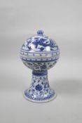 A Chinese blue and white porcelain stem bowl and cover, with scrolling lotus flower, dragon and