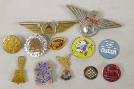 A collection of enamel pin badges including Delta and TWA Airlines etc
