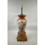 A Japanese Kutani vase converted to a lamp with brass mounts, the body of the vase decorated with