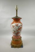 A Japanese Kutani vase converted to a lamp with brass mounts, the body of the vase decorated with