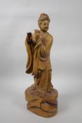 A Chinese carved hardwood figure of a musician, A/F lacks flute, 15" high