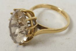 A 9ct gold dress ring set with large oval cut stone, size 'L'