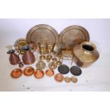 A good quantity of copper and brassware including a copper ½ gallon quart and ½ gill measuring jugs,