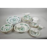 A Newcastle on Tyne China four place setting dragon pattern dinner and tea service