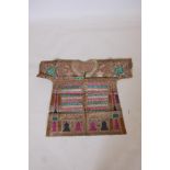 An Islamic linen robe with all over calligraphic inscription decoration, 34" long