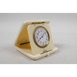 A 1920s ivory cased eight day travel clock with a Swiss movement, retailed by A Barrett & Sons, 63-