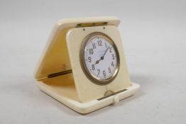 A 1920s ivory cased eight day travel clock with a Swiss movement, retailed by A Barrett & Sons, 63-