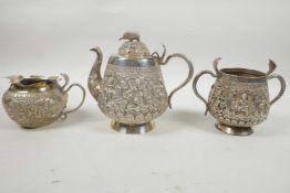 A beautiful C19th Anglo-Indian solid silver (tested) tea service, comprising teapot, cream jug and