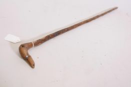 A hedgerow crop with handle carved in the form of a dog's head, set with diamante eyes, 28" long