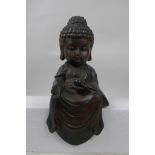 A Chinese bronze mount in the form of a big head Buddha, 10" high
