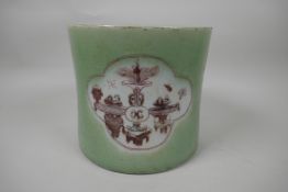 A Chinese porcelain brush pot decorated with panels in puce on a green glaze, 7½" diameter