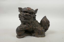 A Chinese bronzed metal fo-dog with gilt patina, 5" high