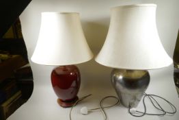 A table lamp of brazed metal construction, 25" high, together with a red glazed ceramic lamp on a