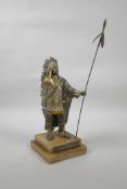 A bronze of Sitting Bull, with gilt and silvered highlights, on a tiered agate stand, spear 14" long