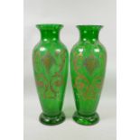 A pair of Bohemian green glass vases with raised gilt decoration, 16" high