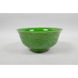 A Chinese apple green glazed porcelain rice bowl with raised dragon decoration, 6 character mark