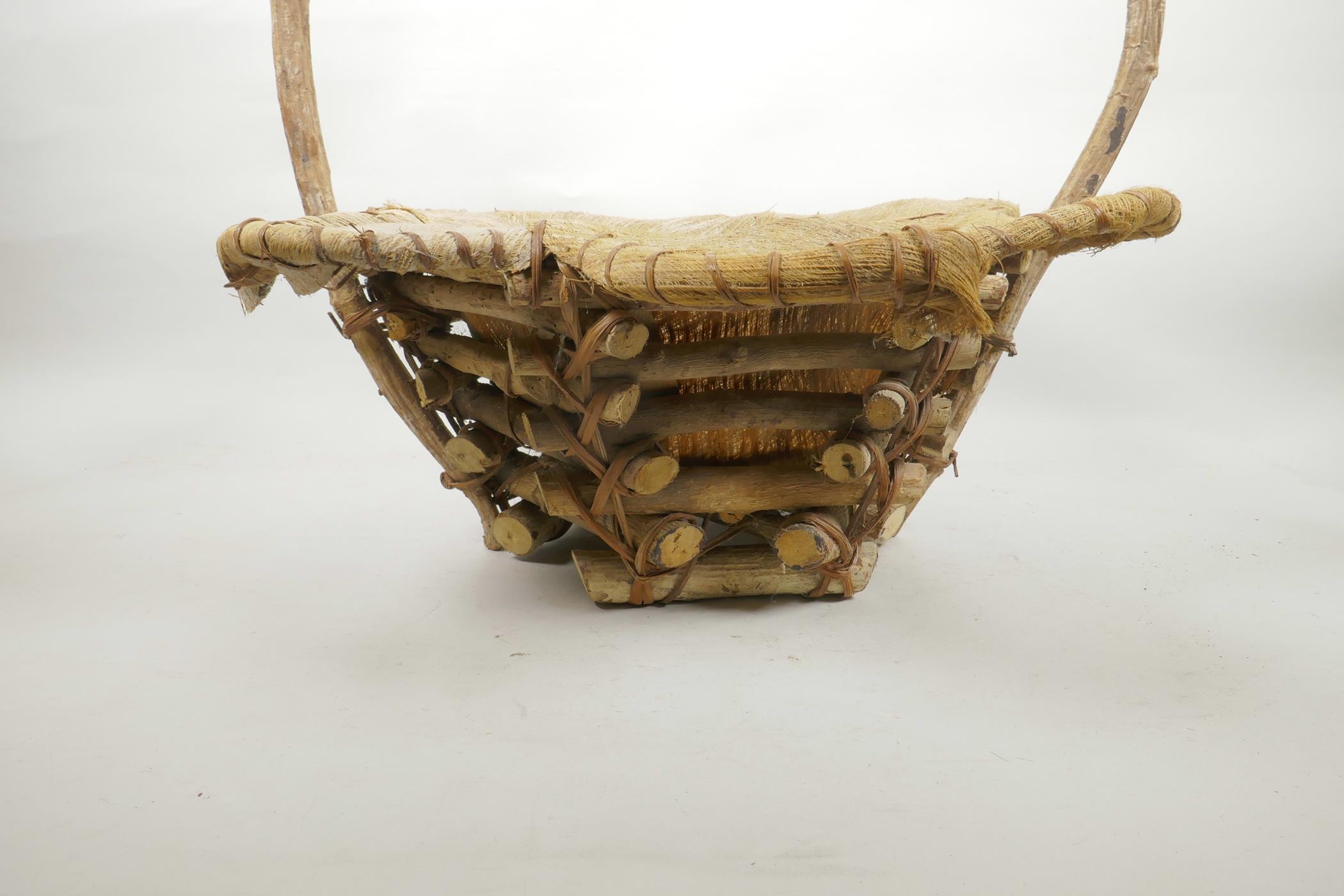 A wood and coconut husk petal shaped basket, 18" high - Image 3 of 3